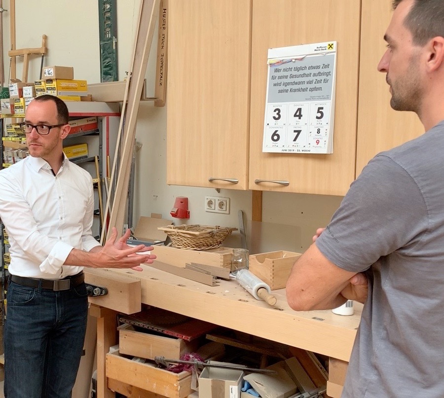 Martin Posarnig in conversation in a joiner's workshop